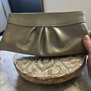 LAUREN MERKIN  GOLD GLITTER, PATTEN LEATHER INVERTED PLEAT CLUTCH